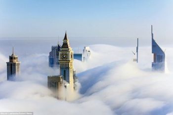 Imagini superbe cu orasul Dubai invaluit de nori - foto 2